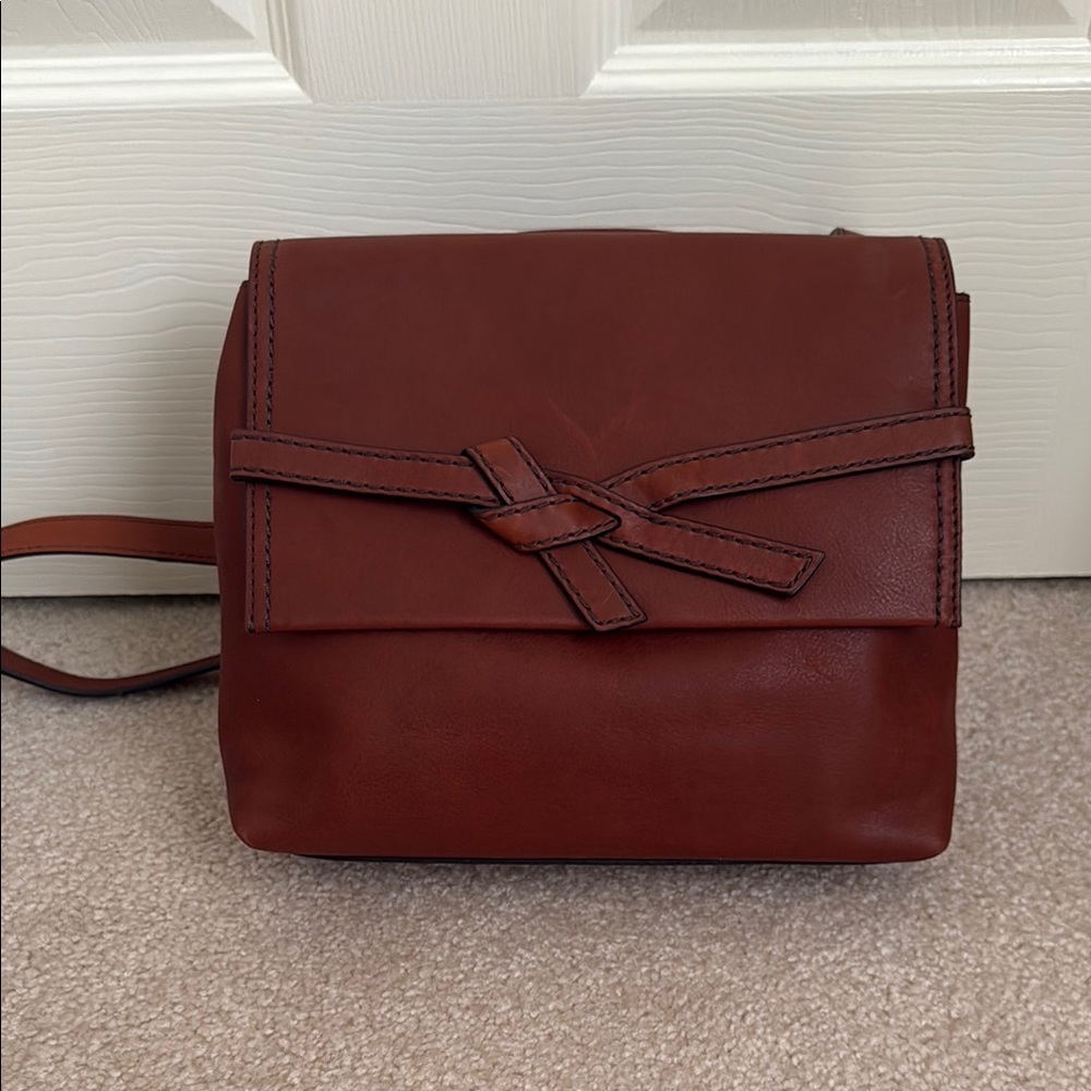 Fossil Brown Crossbody Bag with Flap Closure and Minimalist Design